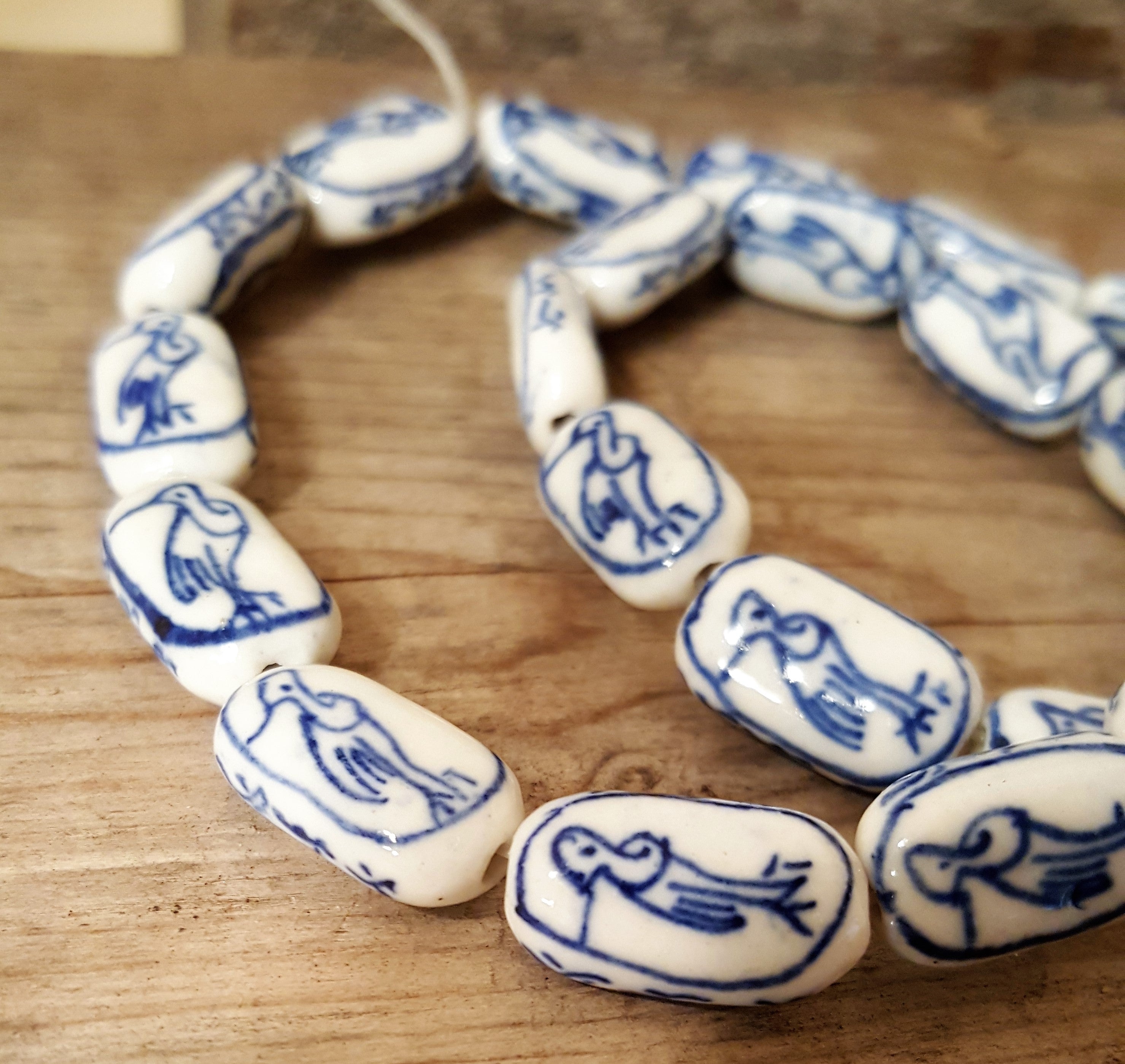 Hand painted navy blue and white beads Porcelain with Asian Loon Bird