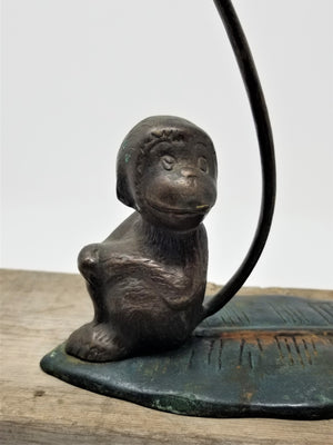 The cutest Metal Monkey Sitting on a Leaf Figurine