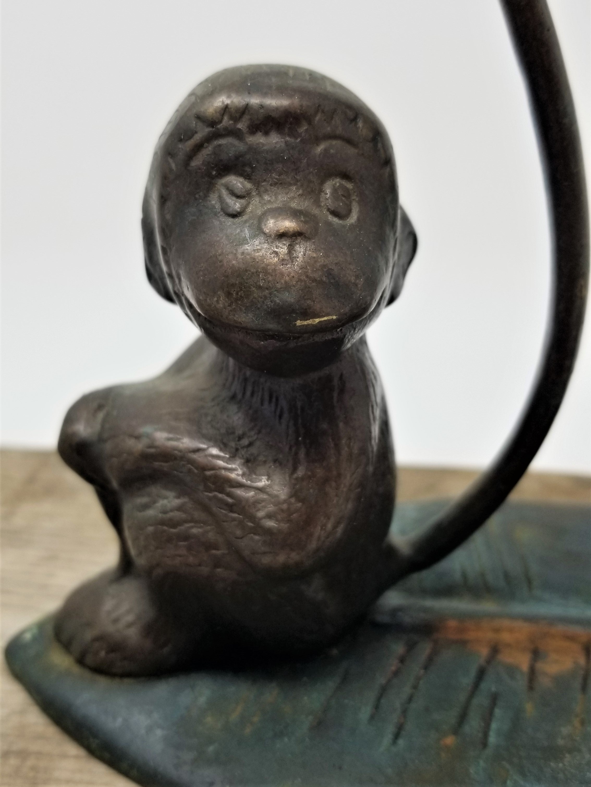 The cutest Metal Monkey Sitting on a Leaf Figurine