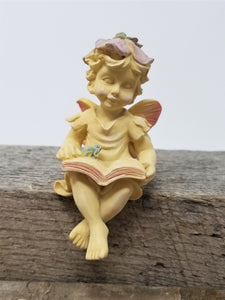 Cute Little Fairy Figurine Reading a Book