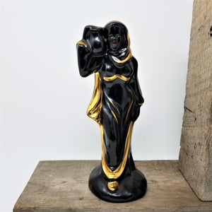 Mid Century Black & Gold Woman’s Figurine Carrying a Jar